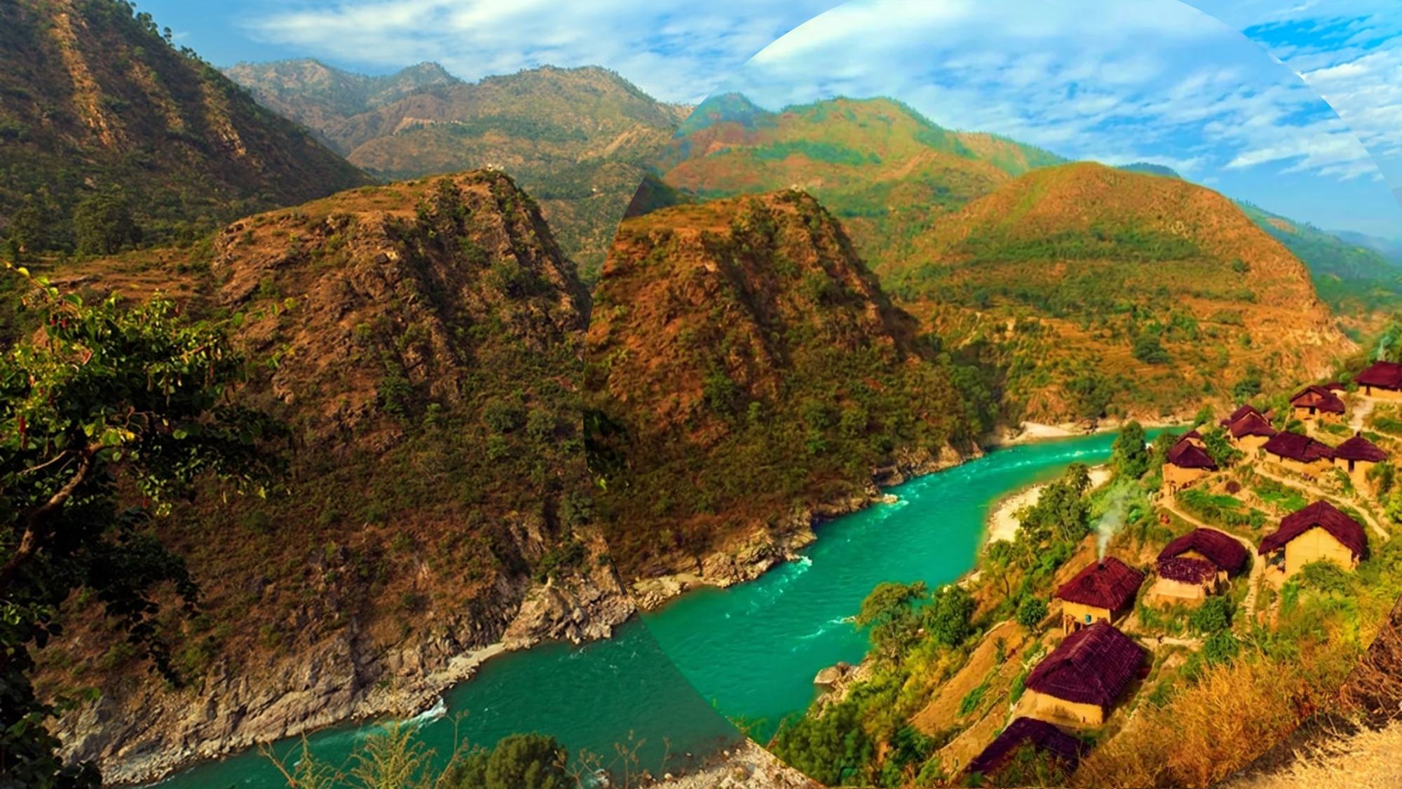 A river valley with terraced hillsides and a village